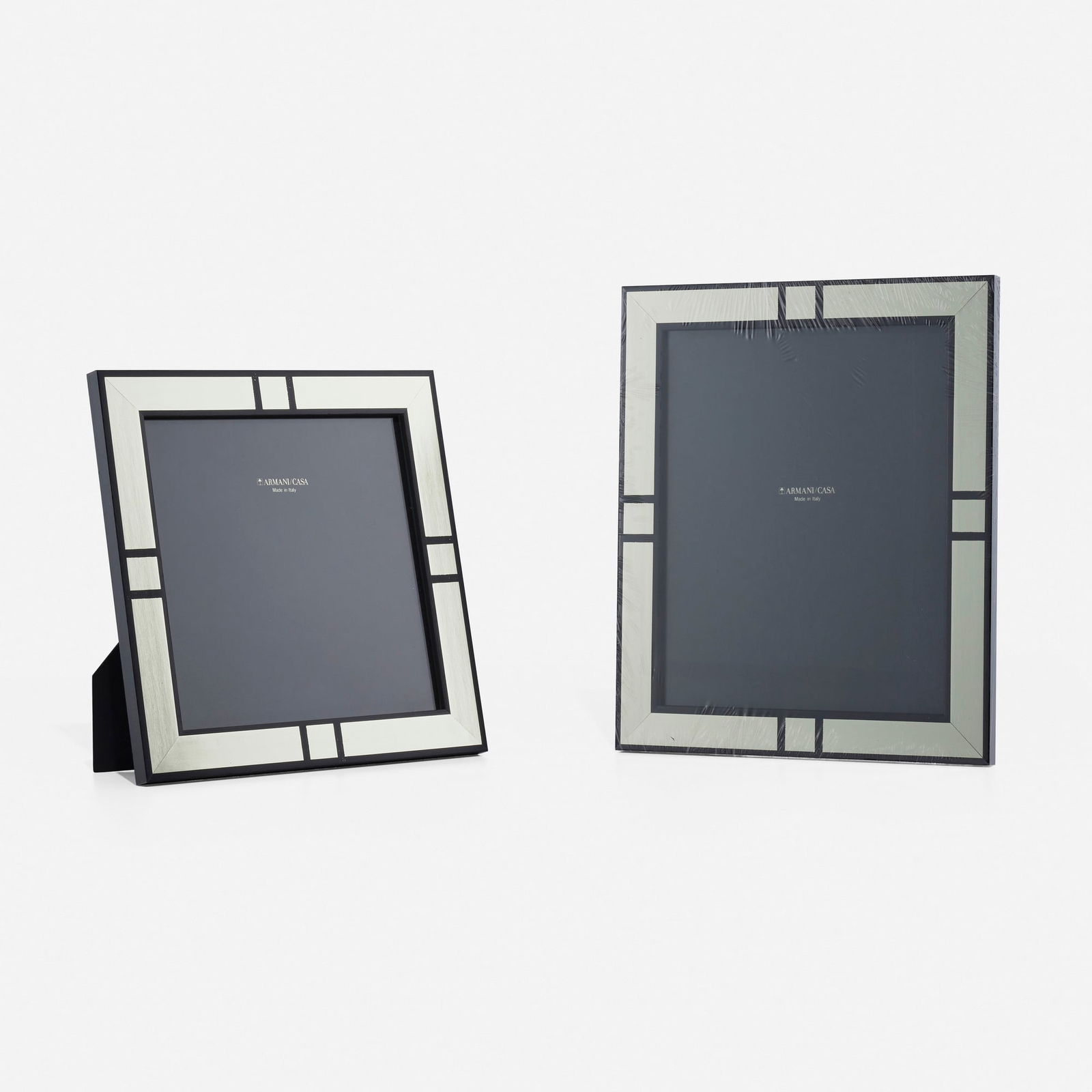 Armani/Casa, Holly picture frames, set of two: Armani/Casa Holly picture frames, set of two Italy, new productionbeech veneer, silver leaf, glass 12 h x 10 w in (30 x 25 cm) 10 h x 10 w in (25 x 25 cm) Stamped manufacturer's mark to bac