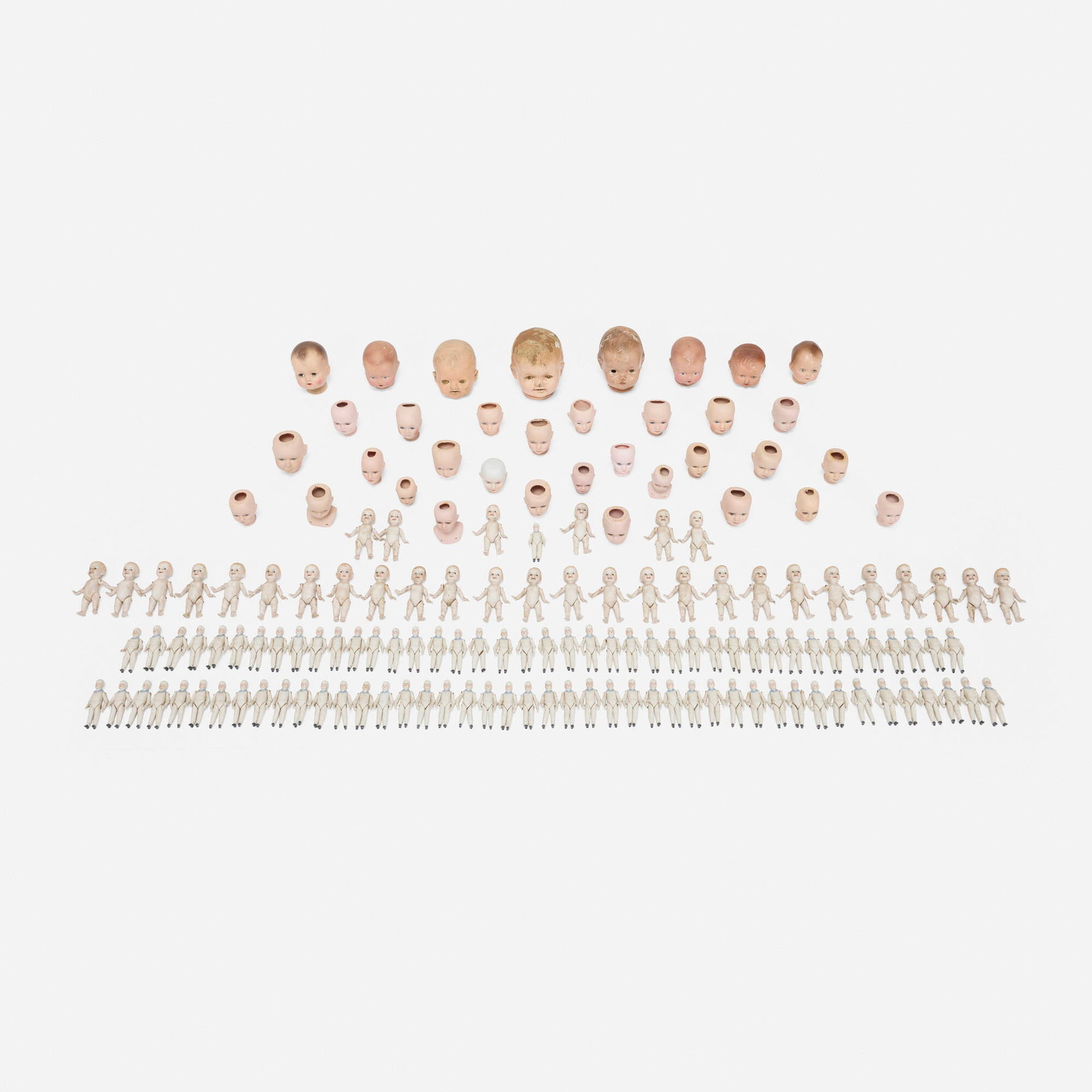 German, Collection of porcelain dolls and doll heads: German Collection of porcelain dolls and doll heads c. 1900painted bisque porcelain, composite largest: 6.75 h x 6 w x 5.75 d in (17 x 15 x 15 cm) smallest: 4 h x 1.75 w x 0.625 d in (10 x 4 x 2 c