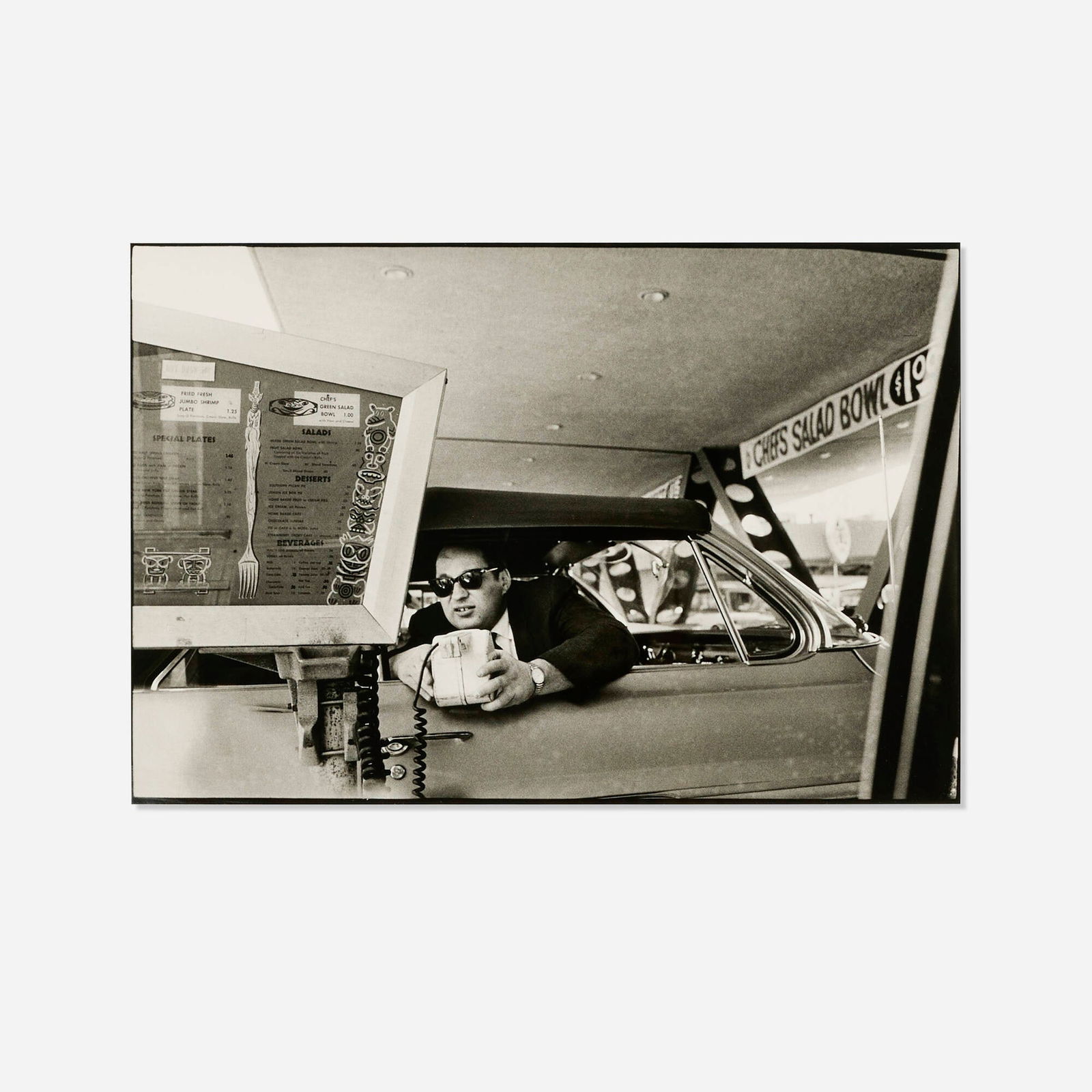 Bruce Davidson, Man Ordering at Drive-In (from the Los Angeles series): Bruce Davidson Man Ordering at Drive-In (from the Los Angeles series) 1963 / printed latergelatin silver print image: 12.25 h x 18.25 w in (31 x 46 cm) sheet: 16 h x 19.875 w in (41 x 50 cm)