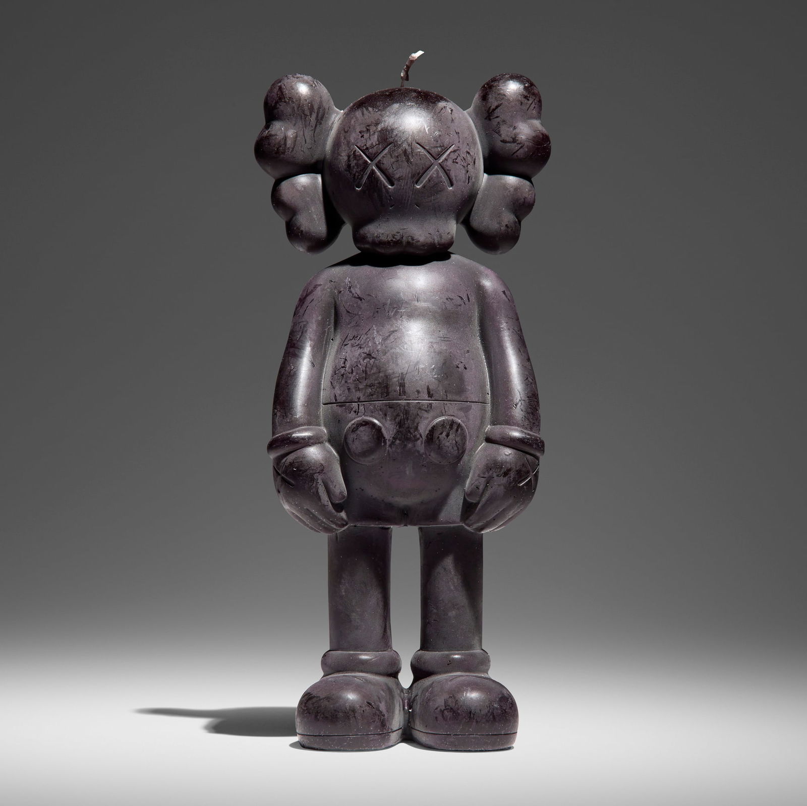 KAWS (Brian Donnelly), Companion Candle (Black): KAWS (Brian Donnelly) Companion Candle (Black) 2012wax 11 h x 4.25 w x 3 d in (28 x 11 x 8 cm) Signed to underside 'KAWS..'. Decal manufacturer's label to underside 'OriginalFake'. This work i