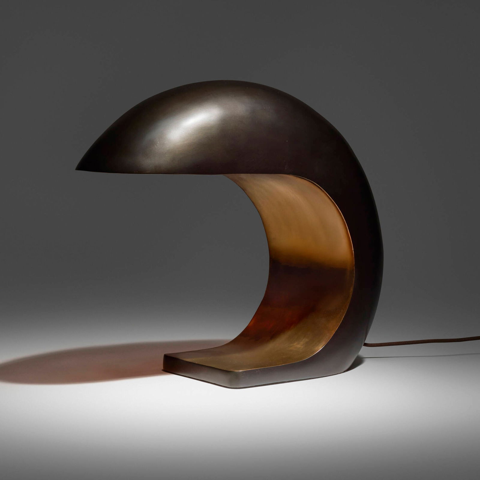 Christopher Kreiling, Nautilus Study desk lamp: Christopher Kreiling Nautilus Study desk lamp USA, 2020patinated and polished bronze 16 h x 7.25 w x 18 d in (41 x 18 x 46 cm) Etched signature and date to lower edge 'C Kreiling 20'. <