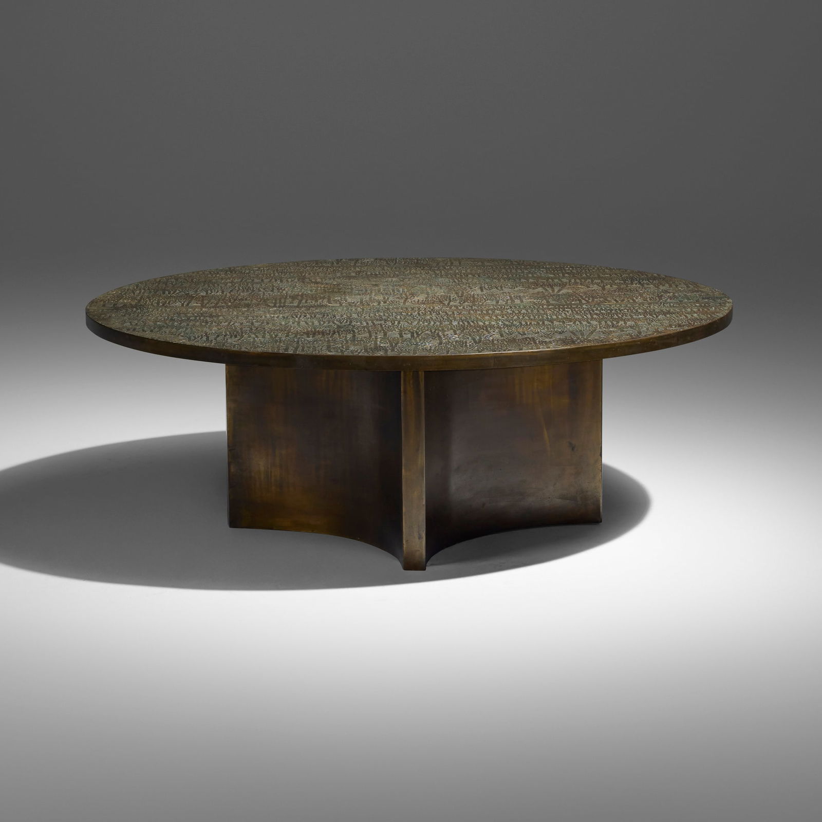 Philip and Kelvin LaVerne, Eternal Forest coffee table: Philip and Kelvin LaVerne Eternal Forest coffee table USA, c. 1965acid-etched and patinated brass, pewter 16.75 h x 47.25 dia in (43 x 120 cm) Raised signature to top 'Philip + Kelvin LaVerne'