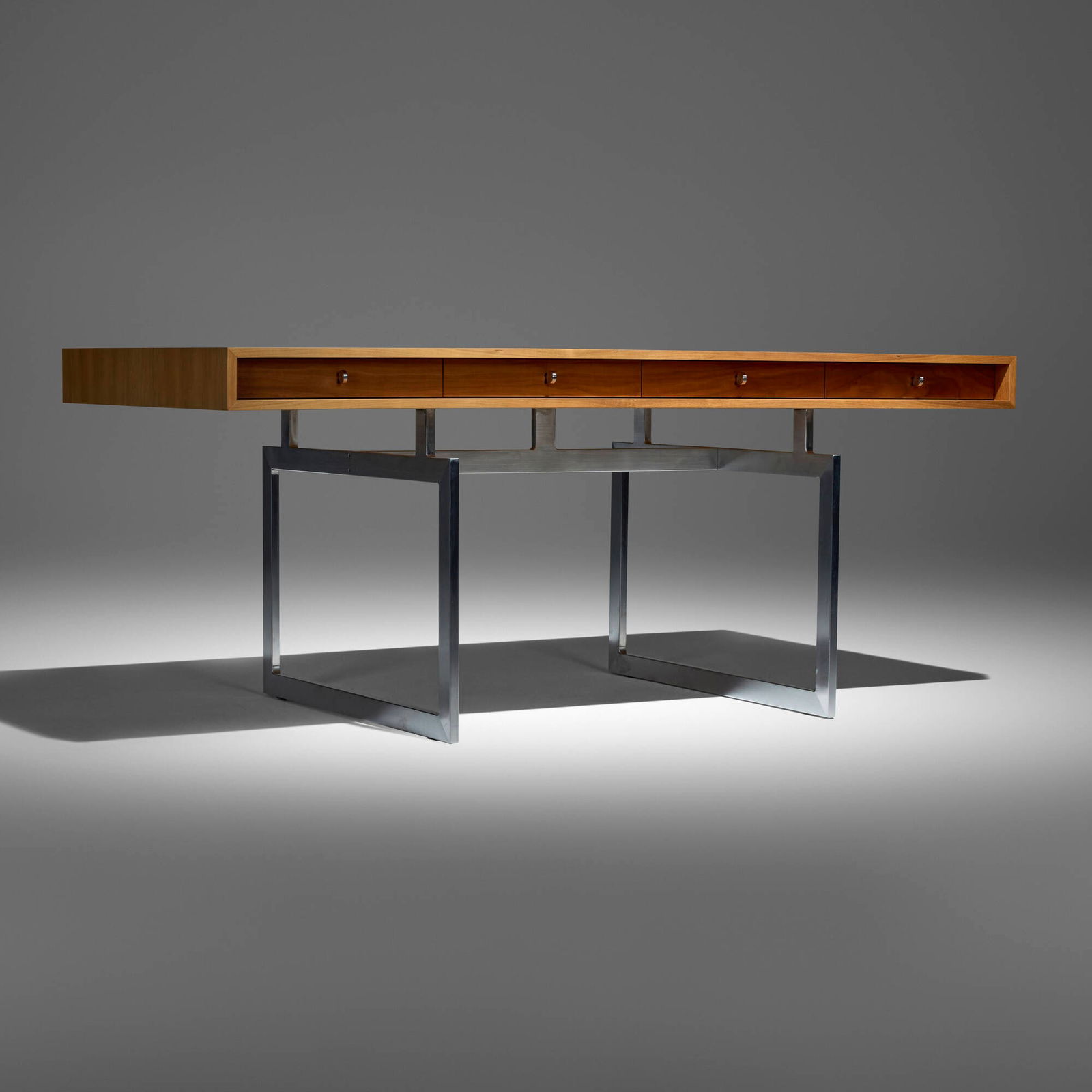 Bodil Kjaer, Office desk: Bodil Kjaer Office desk KarakterDenmark, 1959 / c. 2010brushed steel, walnut 29.75 h x 71 w x 35.25 d in (76 x 180 x 90 cm) Desk features four drawers. Provenance: