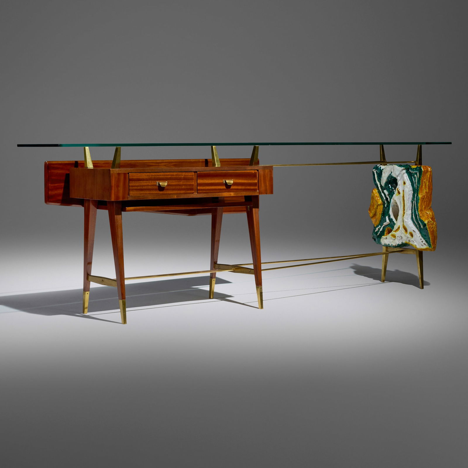 Leoncillo Leonardi, Rare console table: Leoncillo Leonardi Rare console table Italy, c. 1955mahogany, glass, brass, glazed stoneware 35 h x 104 w x 23.5 d in (89 x 264 x 60 cm) Table features two drawers. Inscribed to underside 'Bor