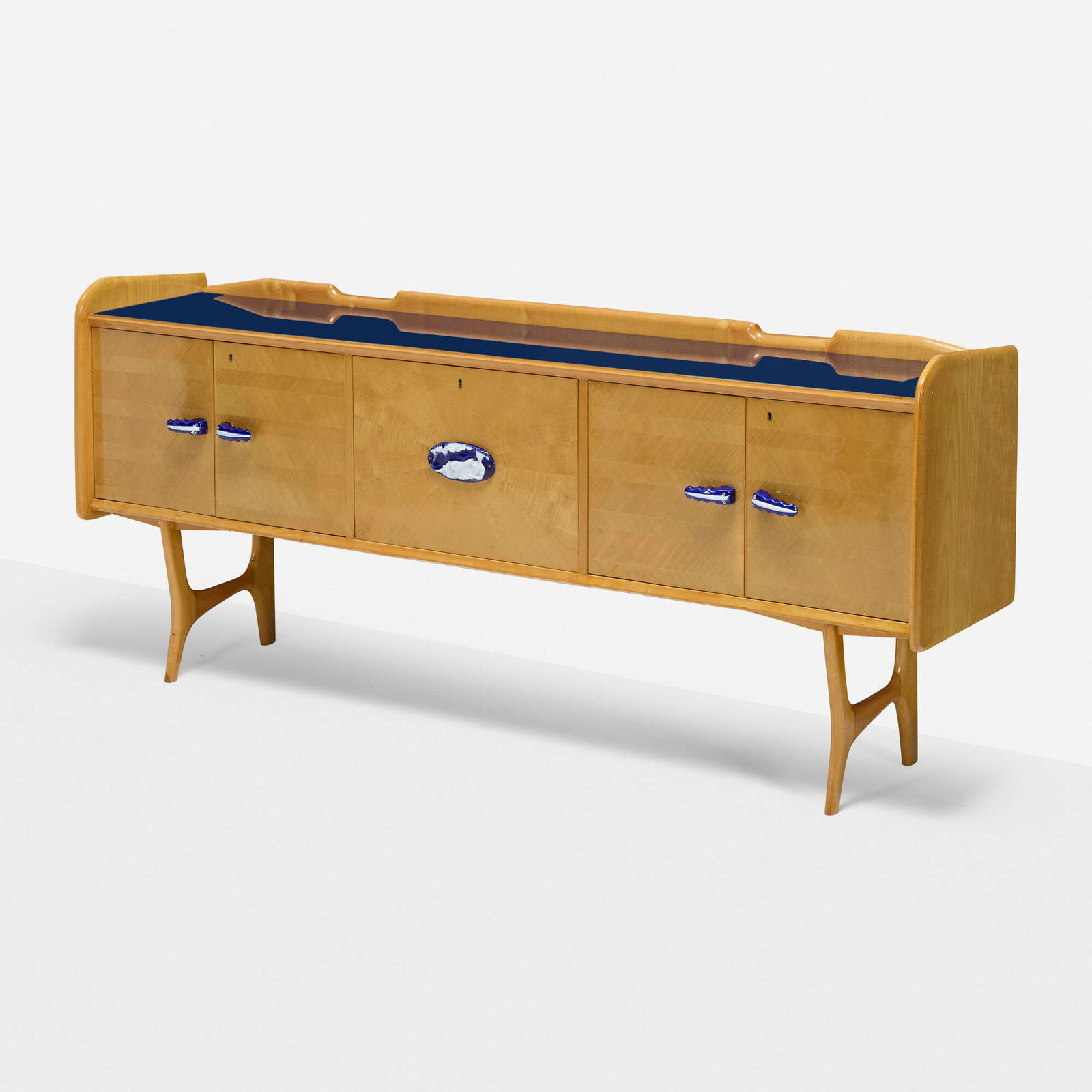 In the manner of Ico Parisi, Cabinet: In the manner of Ico Parisi Cabinet Italy, c. 1950sycamore, glazed stoneware, reverse-printed glass 37.5 h x 86.25 w x 18.25 d in (95 x 219 x 46 cm) Cabinet features four door concealing two s