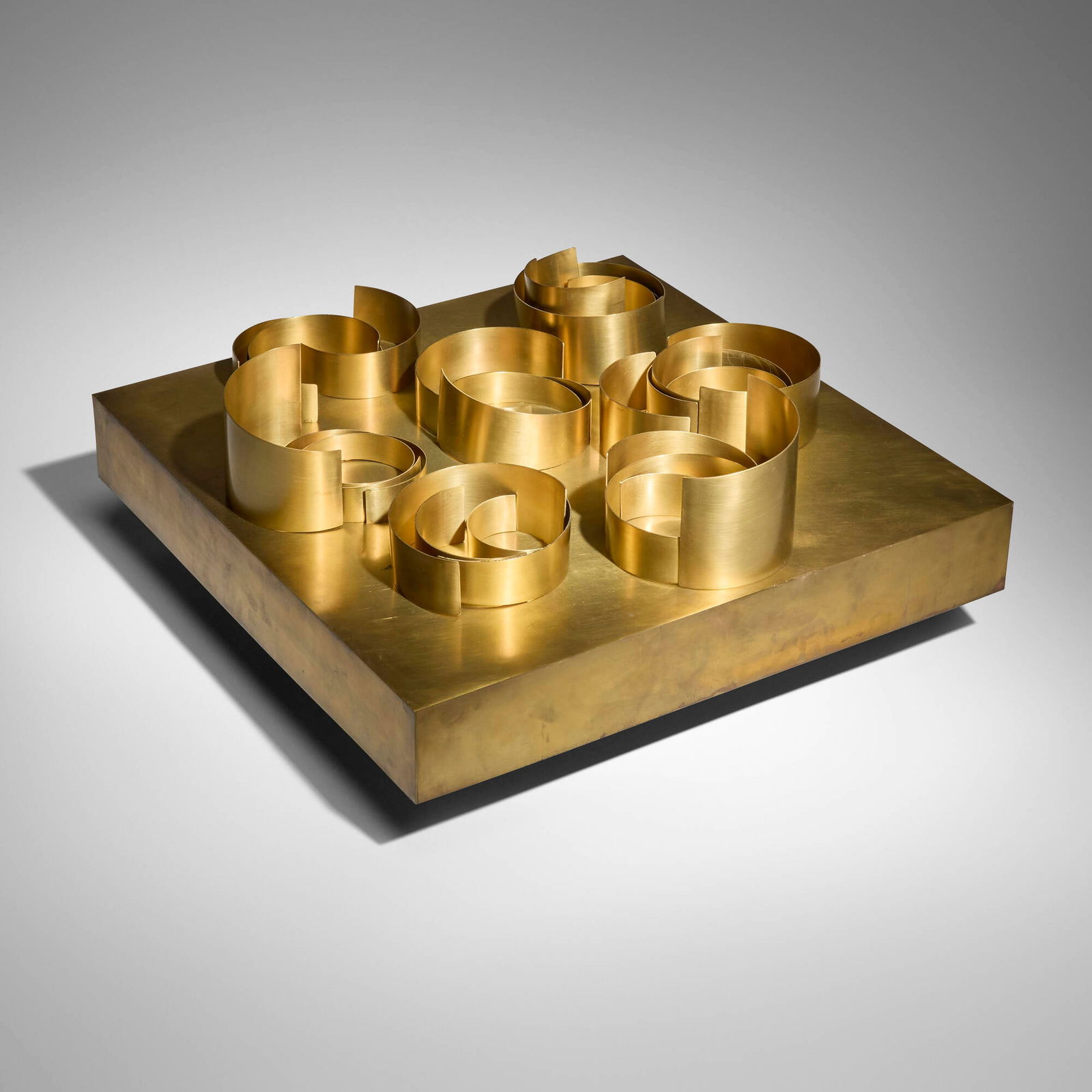 Pol Bury, 29 Formes Courbes-Obliques: Pol Bury 29 Formes Courbes-Obliques 1970brass-plated steel, magnet, motor 11.25 h x 24 w x 24 d in (29 x 61 x 61 cm) This kinetic sculpture features twenty-nine curved forms that shuffle gradu