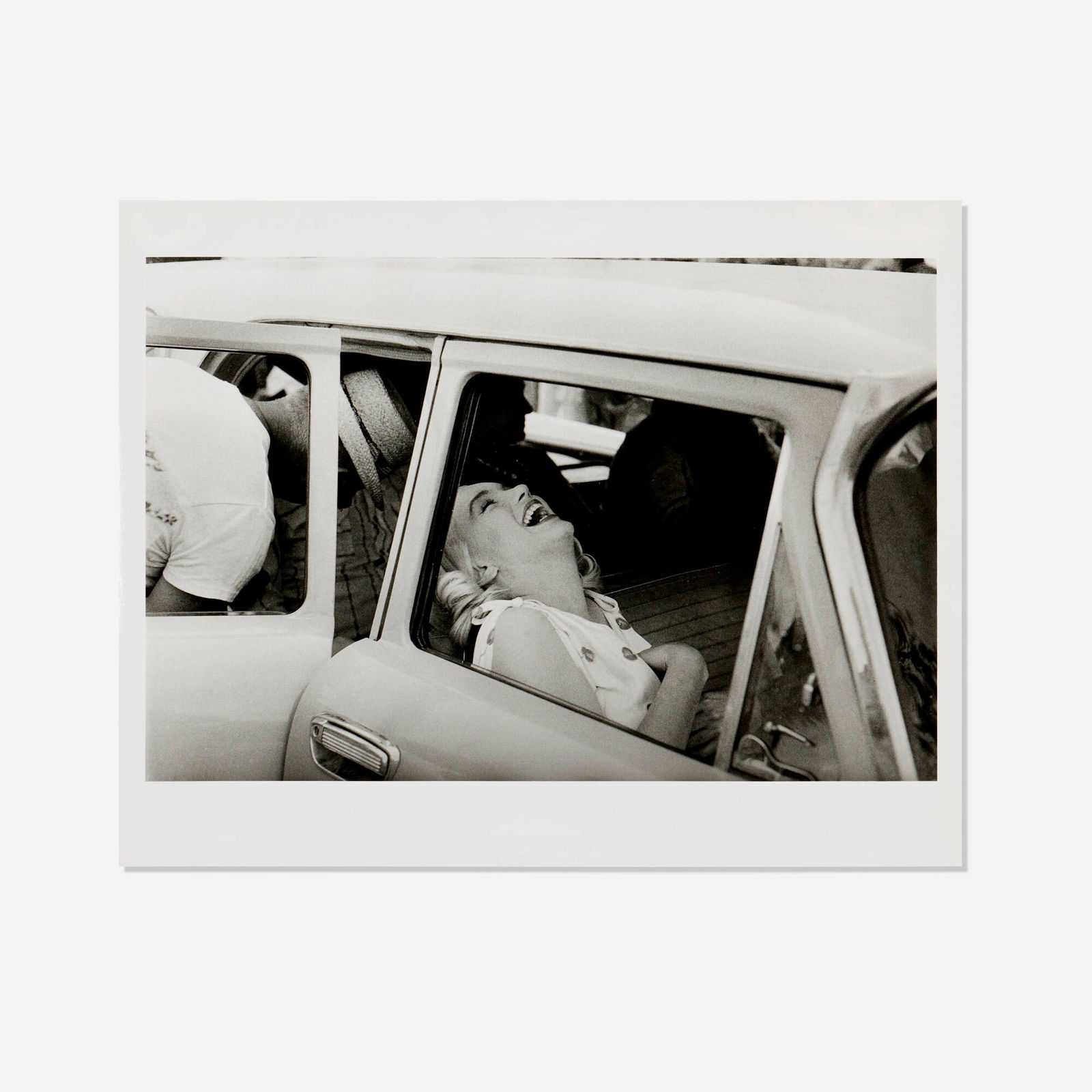 Ernst Haas, Marilyn Monroe laughing in the Car (on the Set of 'The Misfits', Nevada) (1 of 3)