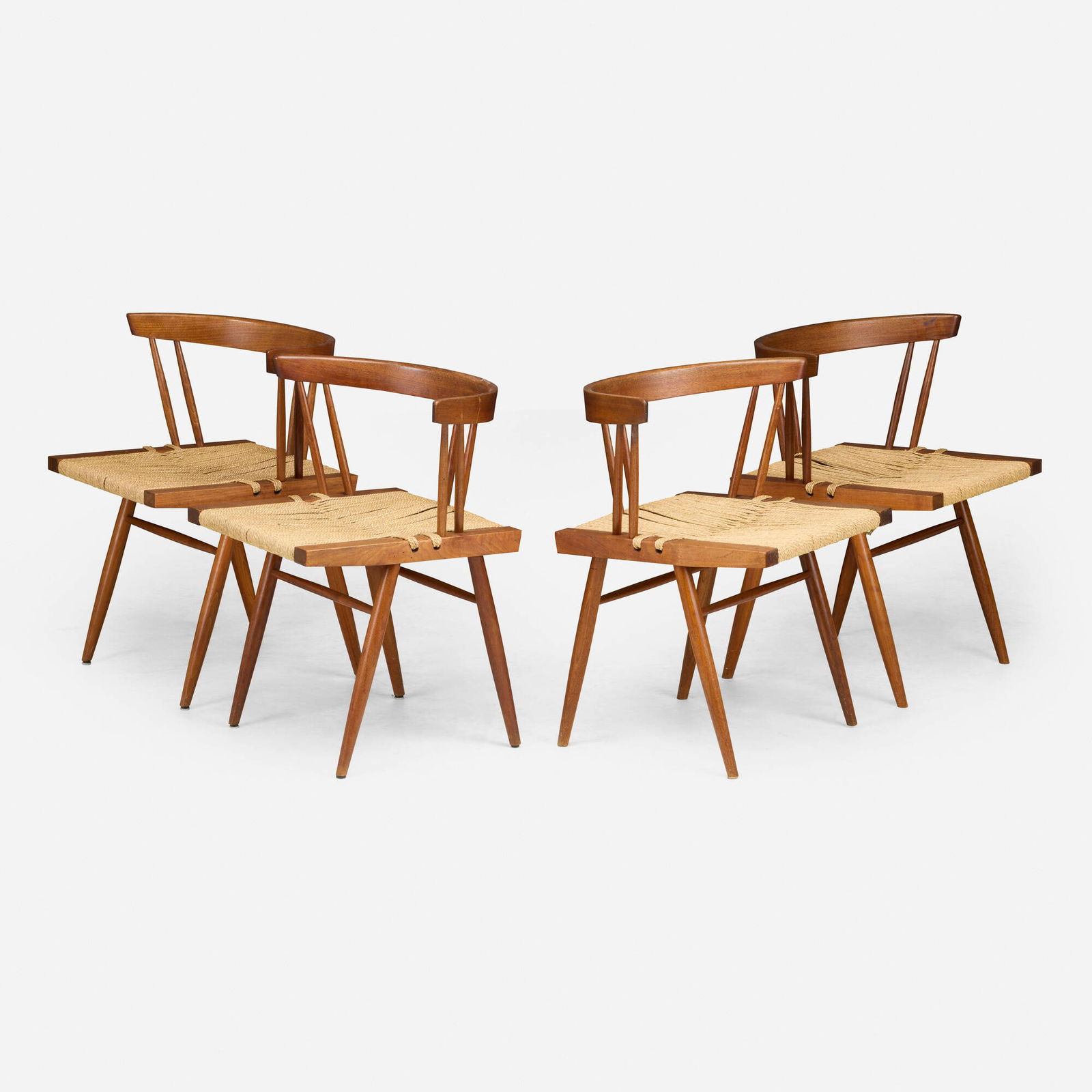 Mira Nakashima, Grass-Seated chairs, set of four: Mira Nakashima Grass-Seated chairs, set of four Nakashima Studio USA, 1994-95 American black walnut, sea grass 26.75 h x 23 w x 19 d in (68 x 58 x 48 cm) Signed and dated to underside of two