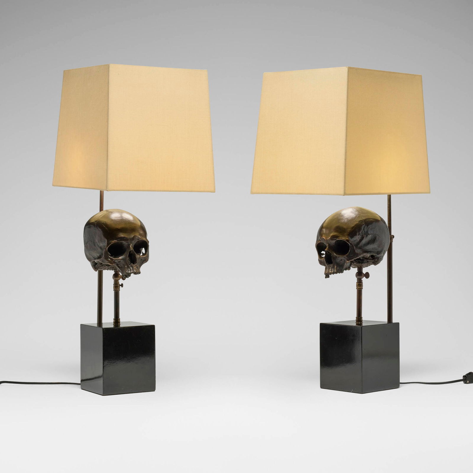 Blackman Cruz Workshop, Skull table lamps, pair: Blackman Cruz Workshop Skull table lamps, pair USA, 1995patinated bronze, lacquered wood, linen 26.5 h x 13 w x 10.125 d in (67 x 33 x 26 cm) Impressed manufacturer's mark to reverse 'Blackman