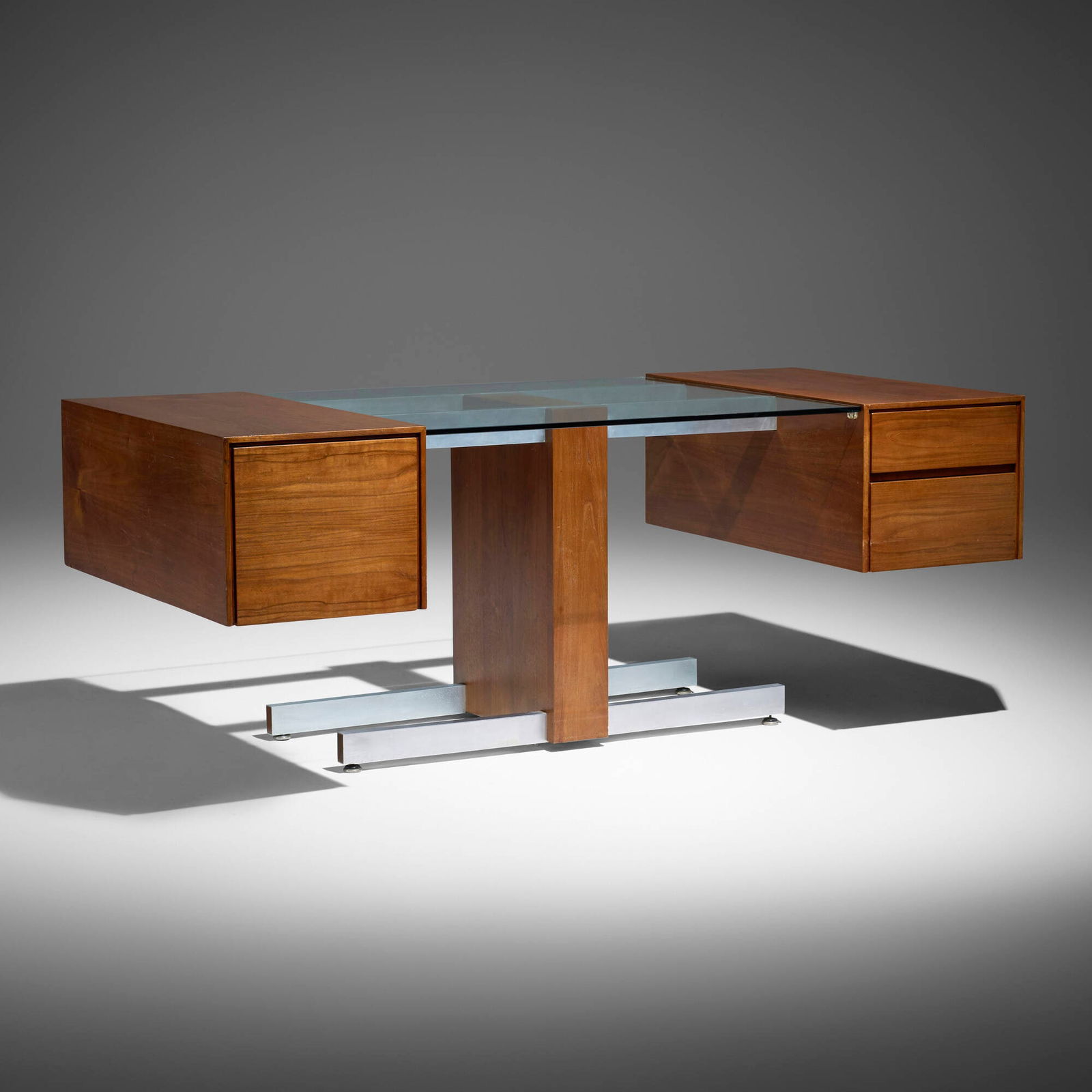 Vladimir Kagan, Desk: Vladimir Kagan Desk Vladimir Kagan Designs, Inc. USA, c. 1970 walnut, aluminum, glass 28.25 h x 73 w x 36 d in (72 x 185 x 91 cm) Desk features three drawers. Provenance: LA Modern Auctions,