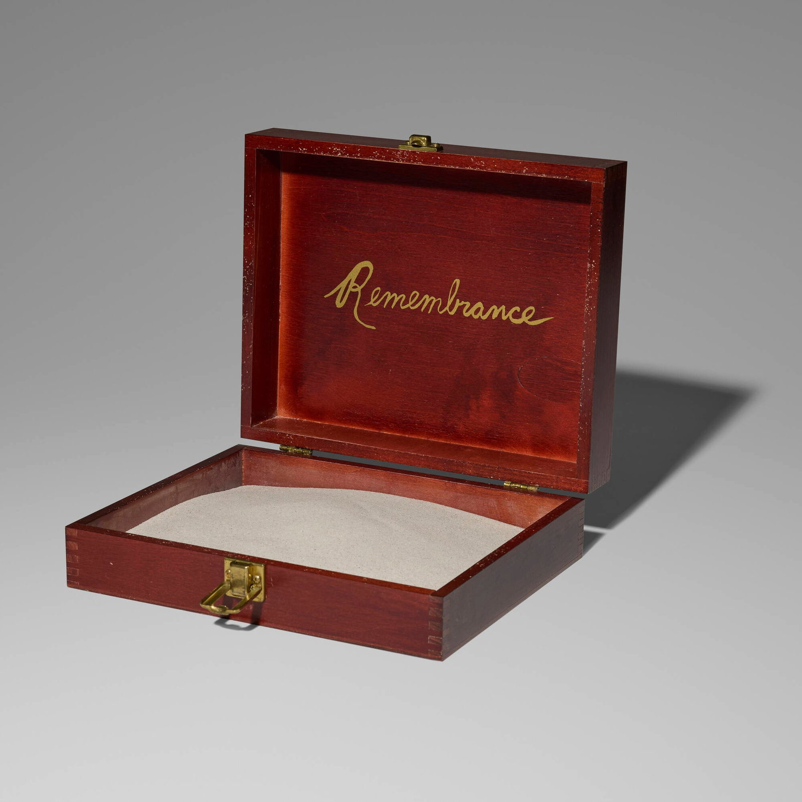 Karen Finley, Remembrance: Karen Finley Remembrance wooden box, sand 3.375 h x 10.75 w x 8.75 d in (9 x 27 x 22 cm) In performance artist Karen Finley's memorial installation Written in Sand (1992-94), damp sand symb