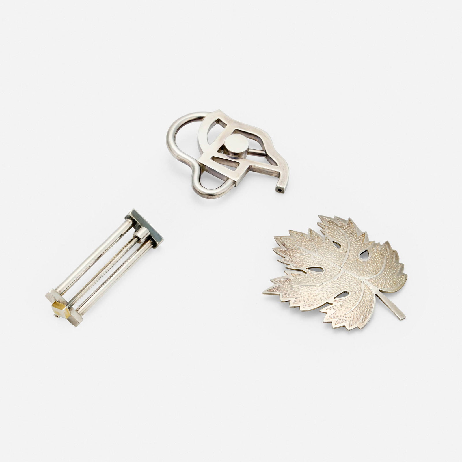 Ettore Sottsass and Adrian Olabuenaga, Collection of three brooches: Ettore Sottsass and Adrian Olabuenaga Collection of three brooches ACME Studio Italy, c. 1995 sterling silver 2.5 h x 2.125 w x 0.375 d in (6 x 5 x 1 cm) 1.75 h x 2.125 w x 0.375 d in (4 x 5 x