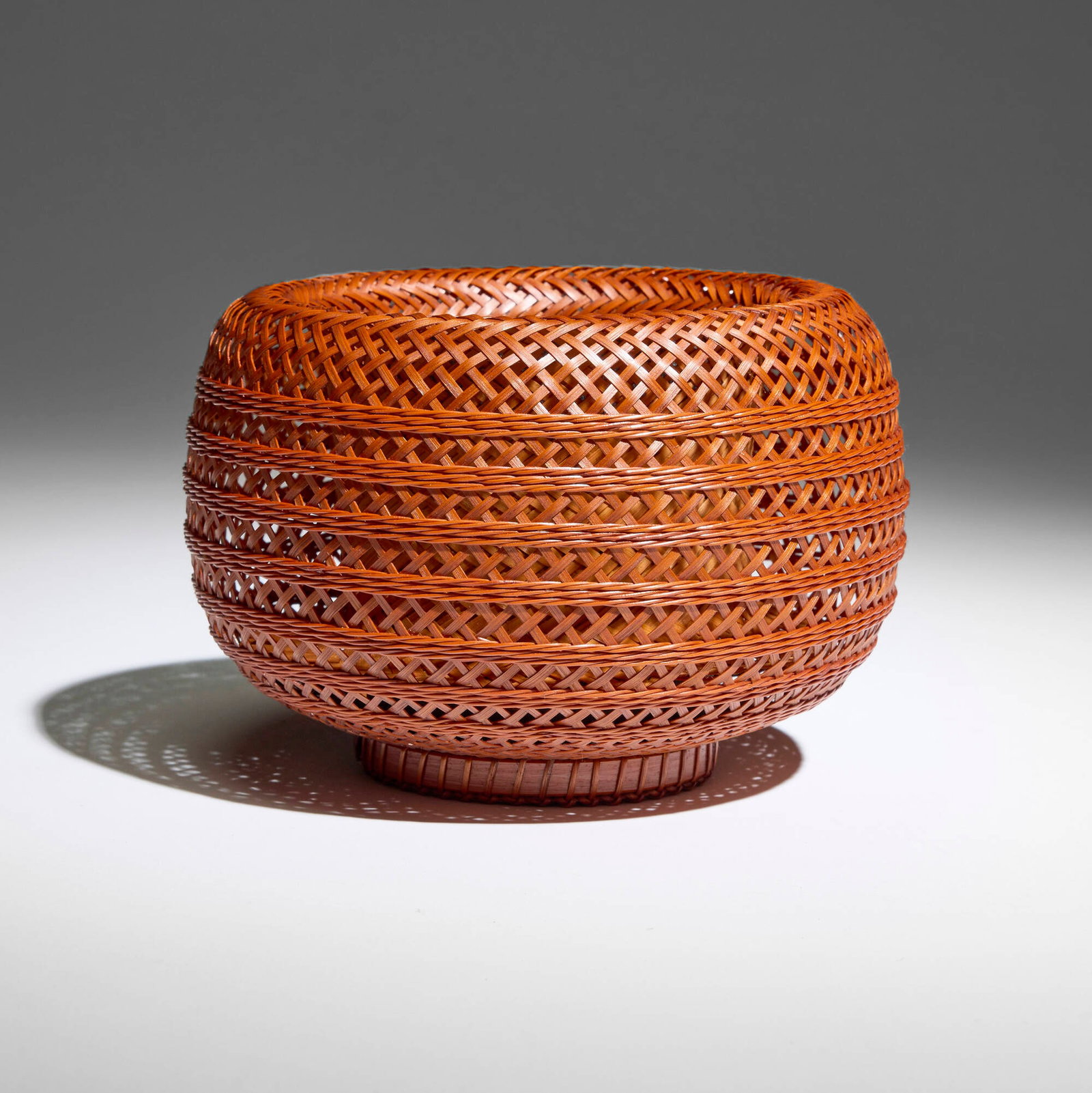 Yagisawa Keizo, Nawame Hanakago (Rope-pattern Flower Basket): Yagisawa Keizo Nawame Hanakago (Rope-pattern Flower Basket) bamboo 4.75 h x 7.25 dia in (12 x 18 cm) Incised signature in kanji to underside. Sold with original signed artist's box (tomobako).<