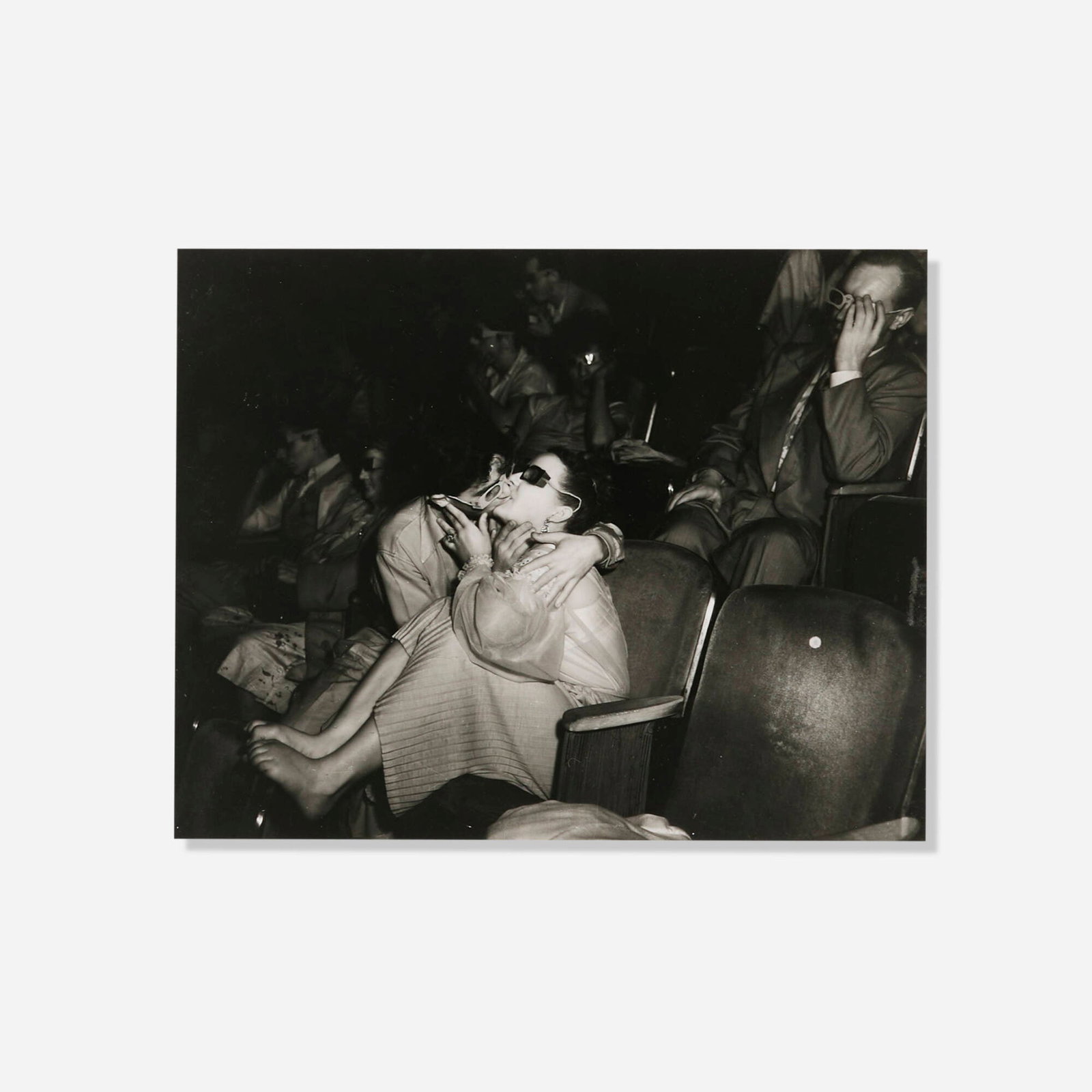 Weegee, Lovers, Palace Theater, New York City: Weegee Lovers, Palace Theater, New York City 1945 / printed 1993 gelatin silver print image: 7.375 h x 9.25 w in (19 x 23 cm) sheet: 8 h x 10 w in (20 x 25 cm) Numbered to estate stamp on verso