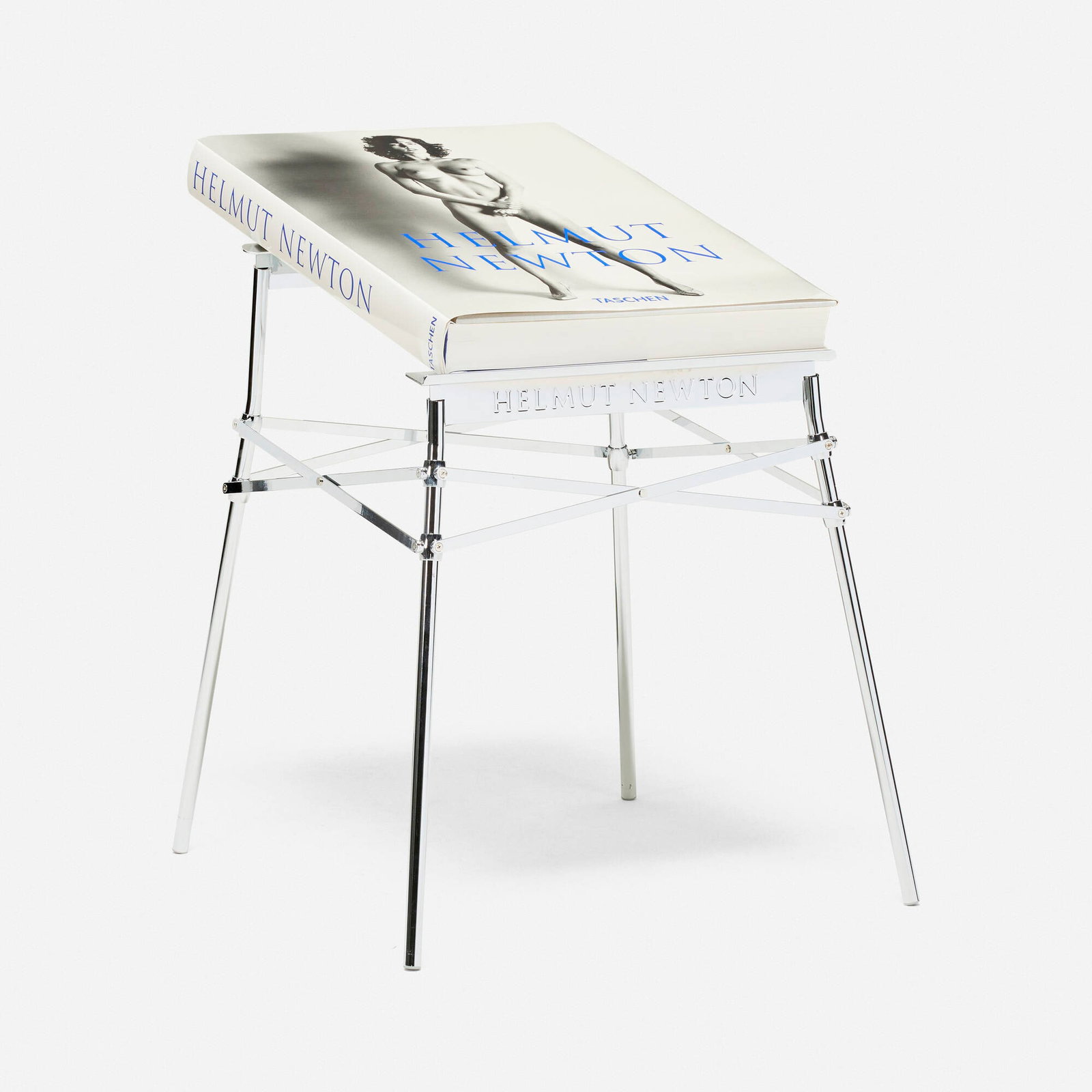 Helmut Newton and Philippe Starck, Baby Sumo with stand: Helmut Newton and Philippe Starck Baby Sumo with stand 2020 bound printed paper; chrome-plated steel book: 3.5 h x 20.5 w x 28 d in (9 x 52 x 71 cm) stand: 29.5 h x 24.5 w x 25 d in (75 x 62 x 63 cm) 