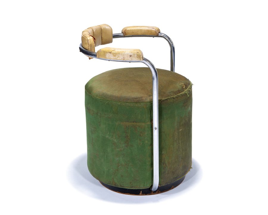 Attributed to Gilbert Rohde, Drum-shaped chair: Attributed to Gilbert Rohde Drum-shaped chair c. 1925 Chrome-plated steel, leather, oil cloth, ebonized mahogany Possibly manufactured by the Troy Sunshade Co. 28.75" x 23" x 21" Estimate: $3000 - $50