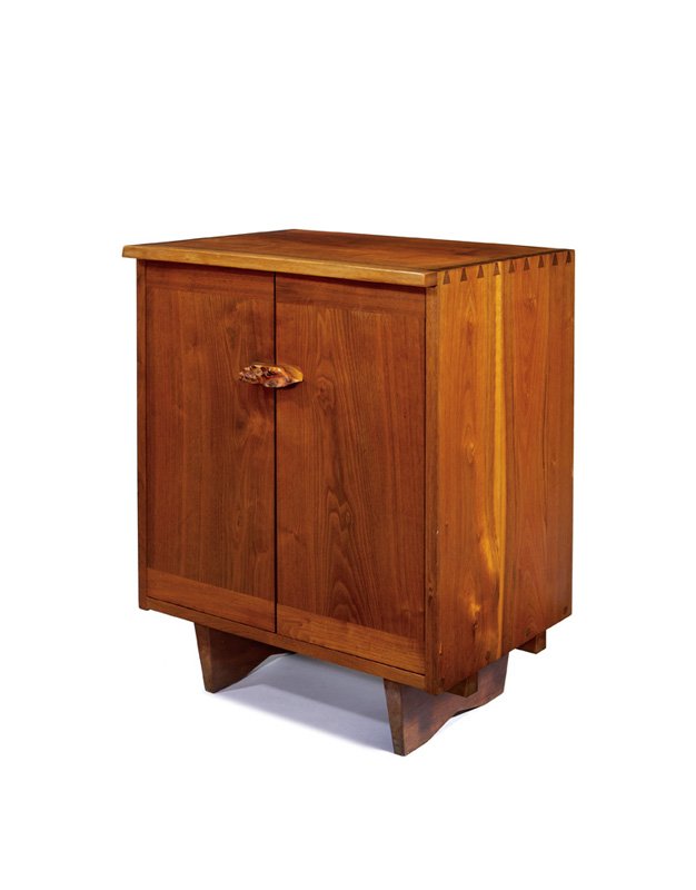 George Nakashima, Tall Kornblut case: George Nakashima Tall Kornblut case Designed c. 1964 American black walnut, English oak burl Studio Marked "3669 How" 30.75" x 24" x 18.25" Literature: Ostergard, Derek. George Nakashima: Full Circle.