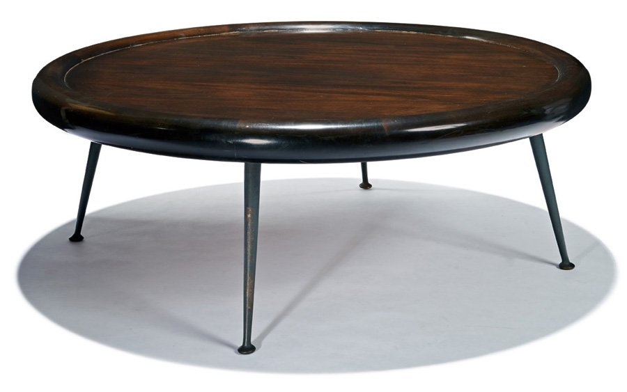 T.H. Robsjohn-Gibbings, Coffee table: T.H. Robsjohn-Gibbings Coffee table Designed c. 1955 Widdicomb Retains Widdicomb label 15.5" x 42" diameter Estimate: $3000 - $5000