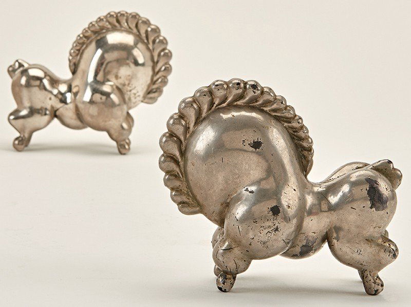 Russel Wright, Libbiloo Bookends (2): Russel Wright Libbiloo Bookends (2) Designed c. 1927 Russel Wright, Inc. One with cast mark to underside "RW" Each: 5.5" x 6.5" x 3.25" Literature: At Home in Manhattan: Modern Decorative Arts 1925 to