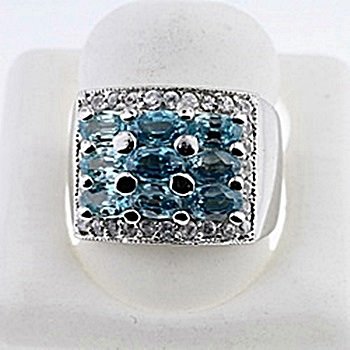 SILVER RING WITH BLUE ZIRCON AND WHITE ZIRCON: Stone : BLUE ZIRCON Metal : SILVER Cts: 2.50 Finish : POLISHED shape : OVAL Gmwt: 5.50 color: BLUE Size;6.5 Stone: WHITE ZIRCON Cts:0.30