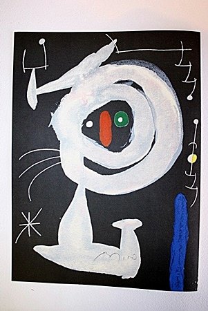 Joan Miro Original Signed Lithograph- "Femme dans la: Lithograph, In the Manner of Joan Miro, bearing the Signature, Titled - "Femme dans la Nuit". Miro was the son of a watChmaking father and a goldsmith mother, he was exposed to the arts from a very yo