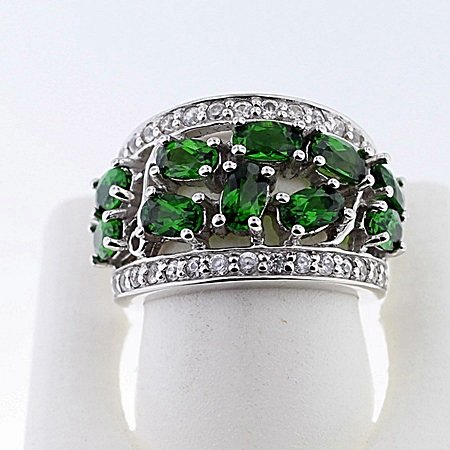 SILVER RING WITH CHROME DIOPSIDE AND WHITE TOPAZ: Stone : CHROME DIOPSIDE Metal : SILVER Cts: 2.50 Finish : POLISHED shape : OVAL Gmwt: 8.50 color: GREEN Size: 5 Stone: WHITE TOPAZ Cts;0.30