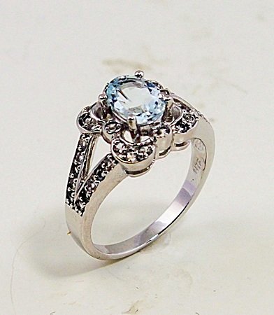 SILVER RING WITH AQUAMARINE AND WHITE ZIRCON: Stone : AQUAMARINE AND WHITE ZIRCON Metal : SILVER Cts: 1.50 Finish : POLISHED shape : RD & OVAL Gmwt:5.00 color:BLUE size:8