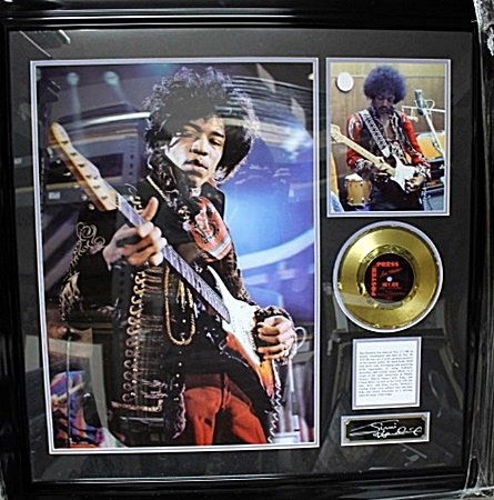 Framed Jimi Hendrix Memorabilia (51FO): Framed Jimi Hendrix Memorabilia pictures with mini gold record approx. 35"x35" Each Item is Made one of a kind in the US to order and may vary slightly from image.