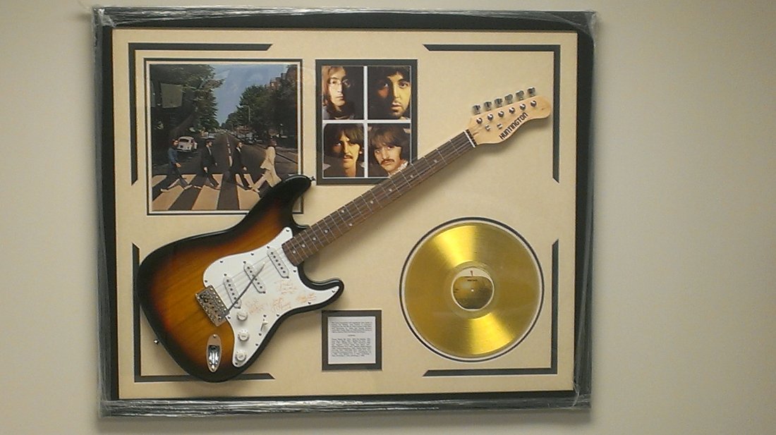 Beatles Autographed Guitar "Abbey Road": Beatles Laser Engraved, Matted and Framed Signatures Guitar (Approx. 42 1/2" X 34 1/2") Featuring the signatures of: - John Lennonrn - Paul McCartney - George Harrison - Ringo Starr Authentic Legends 