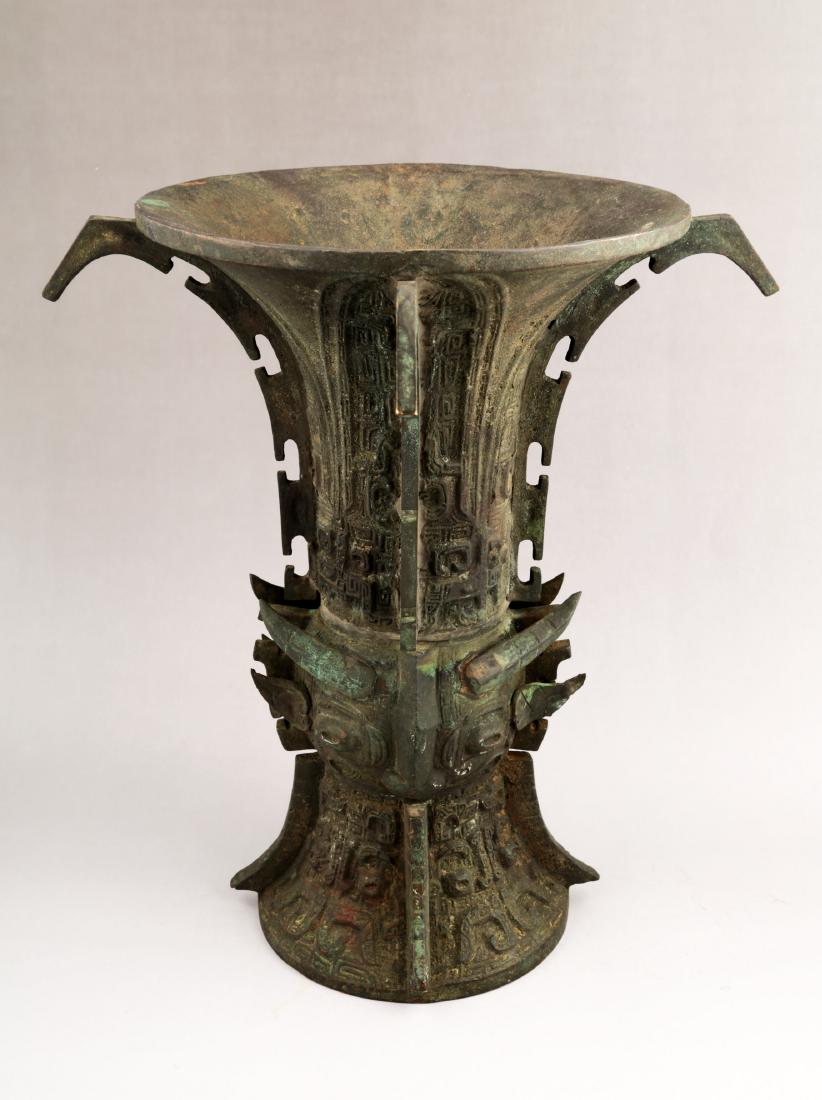A CHINESE QING DYNASTY BRONZE ZUN. (1 of 4)