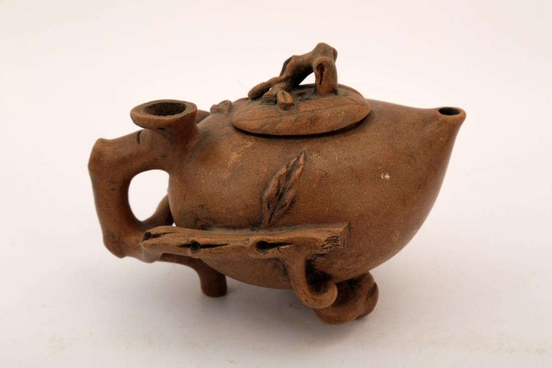 A CLAY LOTUS TEAPOT. (1 of 8)