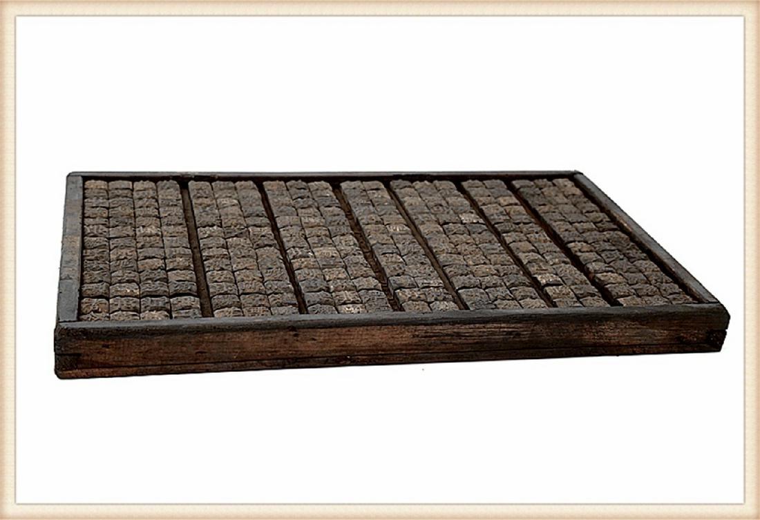 A  BOX FILLED WITH WOODEN MOVABLE PRINTING TYPES. (1 of 2)