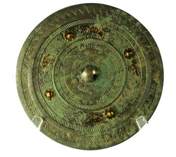 Chinese Silvered Bronze Mirror: Chinese Silvered Bronze MirrorWarring States/Han Dynasty Cast with a wide plain rim around a recessed register of stylized dragons and raised gold plated knops, rope twist borders and a central knop,