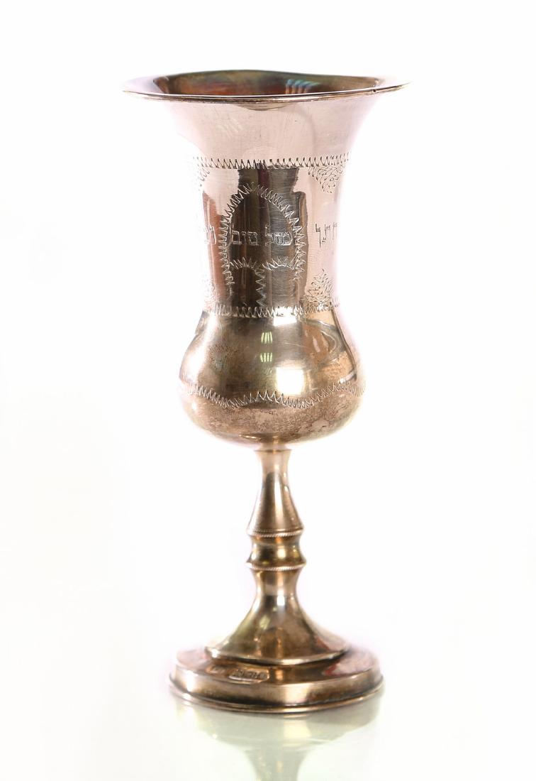 Kiddush goblet. Silver [hallmarked]. England, start of: Kiddush goblet. Engraved and marked silver [English marks]. The words ×ž×–×œ ×˜×•×‘ ×—×ª×Ÿ ×•×›×œ×” on the side [Mazal Tov groom and bride]. Delicate lattice-like desi