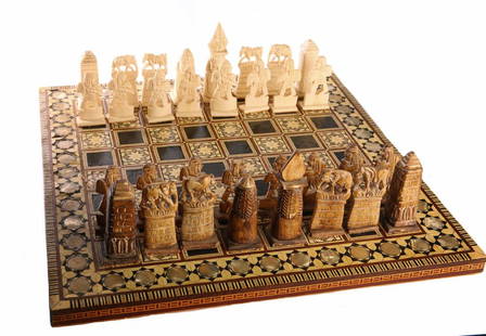 Egyptian Chess, Ivory with Mother of Pearl. Egypt,: Egyptian chess set. Ivory, start of the 20th century. Mother of pearl is set around the chessboard and in the squares on the board. The ivory chessmen are shaped like pharaohs and other images from an