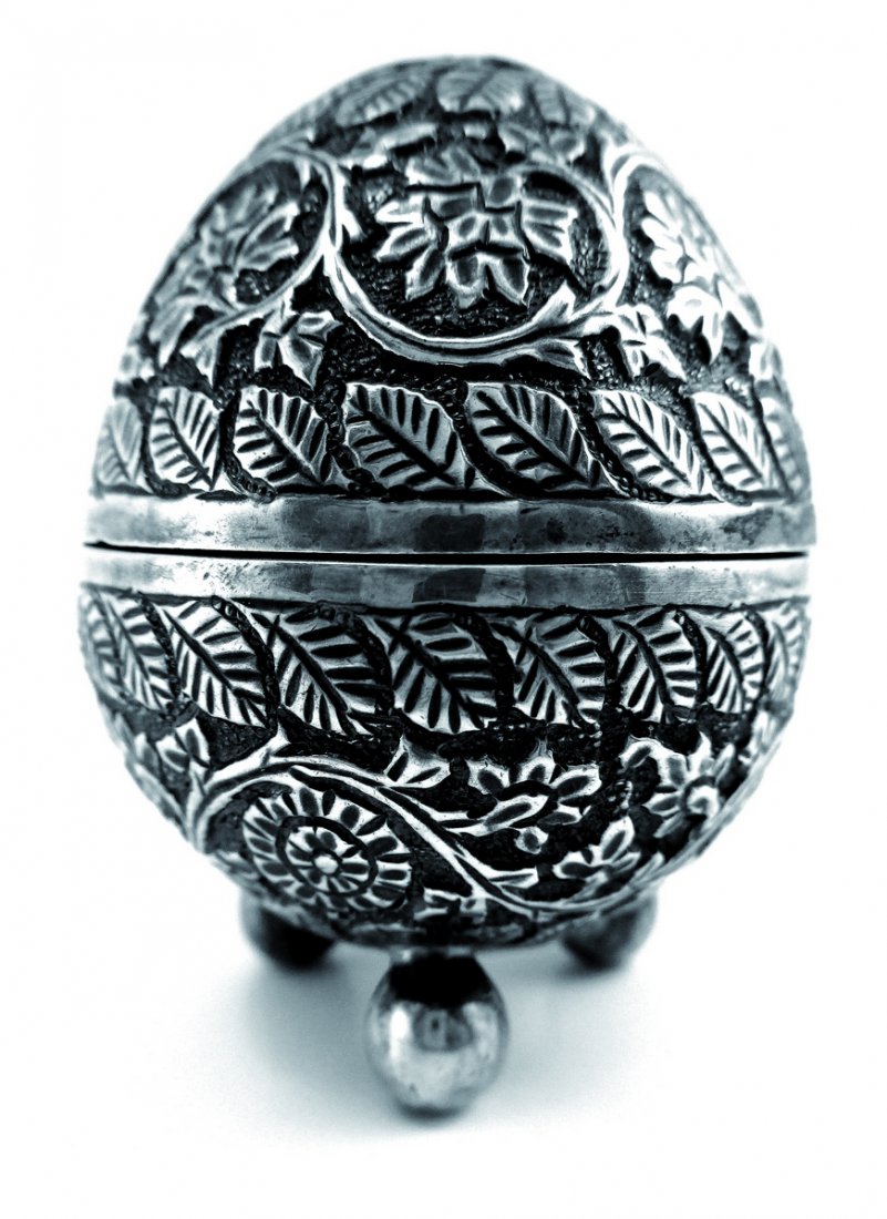 Spice Box. Silver. Turkey? End of the 19th Century: Spice box. Silver, no hallmarks. Oriental style, Turkey?Shaped like an egg. Stands on three small, balls. Nice decorations of leaves and flowers over the surface. When turned, the egg opens for the sp
