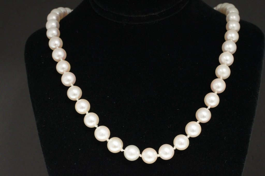 Cultured Pearl Necklace: 14k yellow gold clasp on 17 inch long Cultured pearl necklace. Pearls 7.00 -7.15mm round white. Minor blemishes. Good luster. Nicely matched. Est 350 - 500
