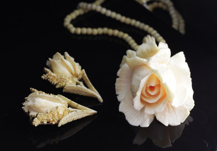 Vintage Chinese Carved Ivory Necklace & Earrings: Vintage Chinese Carved Ivory Necklace and Pair of Earrings 11 1/2" long (necklace). The necklace with small ivory balls and carved floral pendant, together with a pair of carved ivory flower and stem 