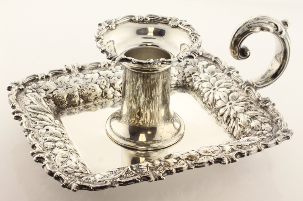 Gorham Silver Repousse Chamber Candlestick: EST 250-350 Gorham Manufacturing Co., Providence Rhode Island, 1890 Marks: (lion-anchor-G), STERLING, (1890), 10, 130. 2 3/4" high x 6 3/8" wide x 5" deep. 7.66 troy ounces. The chamber candlestick of