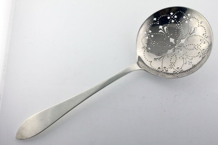 Tiffany Silver Faneuil Pattern Pea Server: EST 200-300 Tiffany & Co., New York, New York, designed 1910. Marks: TIFFANY & CO, STERLING, M. 9" long. 3.21 troy ounces. The pea server in the Faneuil pattern with pierced bowl. Condition: minor sur