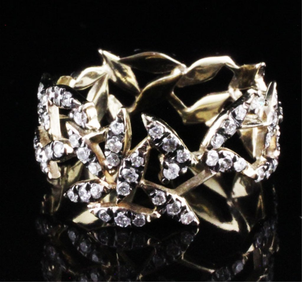 H. Stern Noble Gold Nature Collection Diamond Ring: Est. $1200-$1600 18k yellow with black accents (Noble Gold) 3.40 grams. Diamonds 1 ct tw approx. Si near colorless. Round brilliant cut. Like new. H. Stern Nature collection.