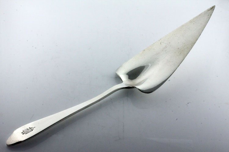 Tiffany Silver Clinton Pattern Pastry Server: Tiffany & Co., New York, New York, designed 1912, Marks: TIFFANY & CO., STERLING, M, 11 inches long, 4.37 troy ounces. The pastry server in the Clinton pattern, monogrammed to the front of the termina