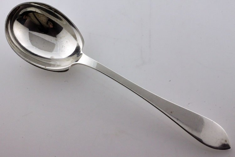 Tiffany Silver Faneuil Pattern Sugar Spoon: Tiffany & Co., New York, New York, designed 1910, Marks: TIFFANY & CO., STERLING, M, 5 3/4" long, 1.41 troy ounces. The sugar spoon in the Faneuil pattern. Condition: minor surface scratching.