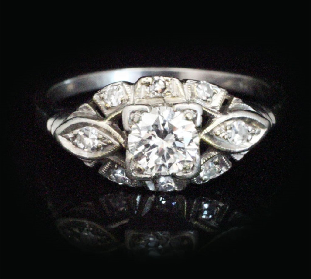 Jewelry-Vintage .75ct tw Diamond Ring in Platinum: Est. $1750-$2300 Vintage .75ct tw Diamond Ring in Platinum. Platinum 4.18 grams. Center stone .50ct approx. G-H VS1 round. Accents (8) .25ct tw single cut SI white.