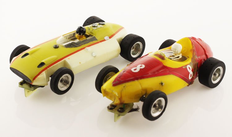 Vintage Racing Slot Cars: Est. $50-$100 Vintage Racing Slot Cars. (2) Vintage competition slot cars. 3 inch wheel base. Aluminum wheels. Minor losses due to apparent use. Overall dimensions 4.25 inches X 2 inches.