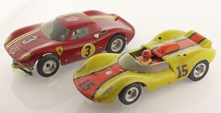 Vintage Racing Slot Cars: Est. $50-$100 Vintage Racing Slot Cars. (2) Vintage competition slot cars. 3 inch wheel base. Aluminum wheels. Minor losses due to apparent use. Overall dimensions 5 inches X 2 inches.