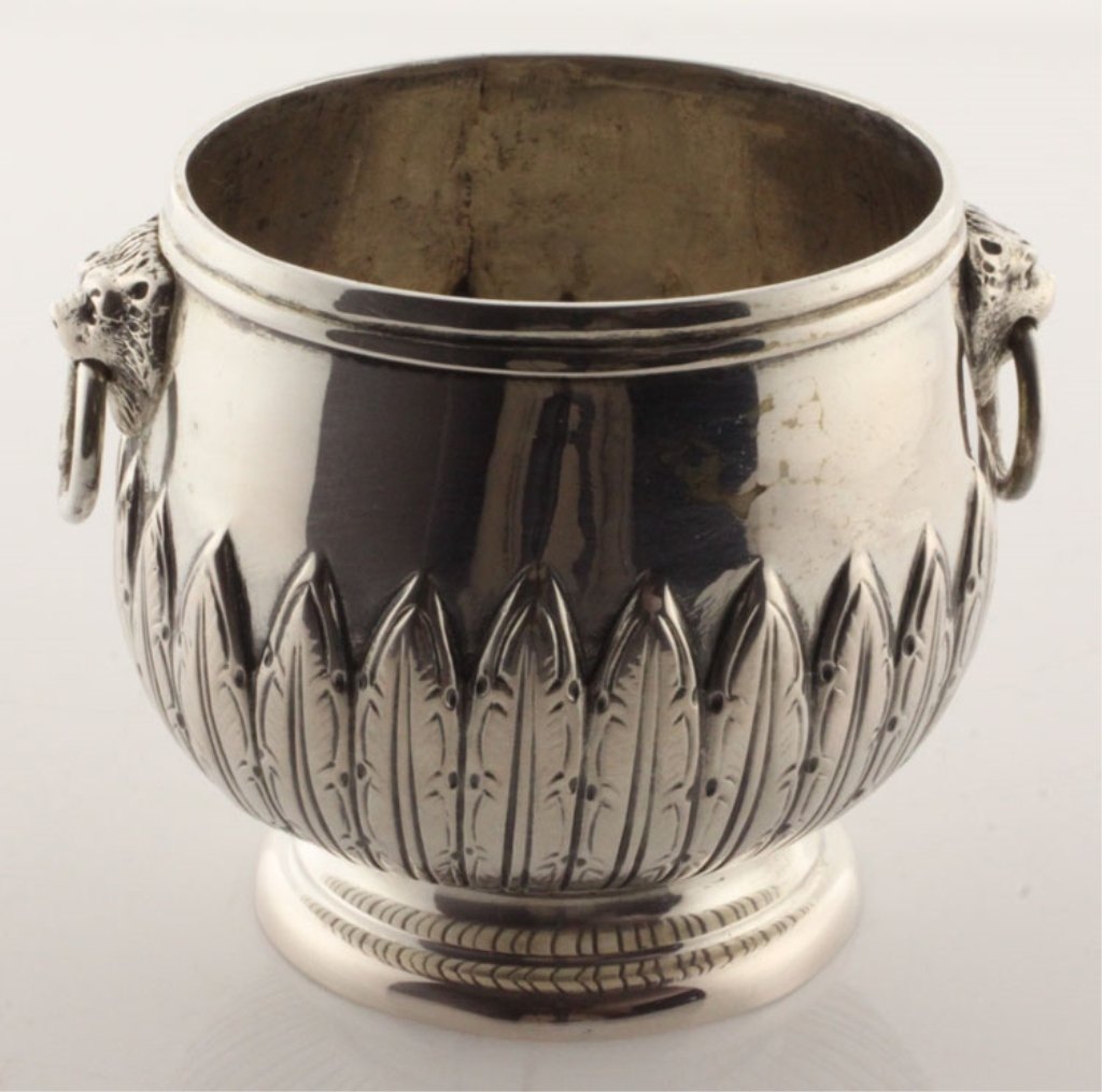 Continental Silver Small Bowl: Est $100-$150 Circa 1950, Marks: (shield with heraldic devise and crossed keys), AG, 2¼ inches high, 3.01 troy ounces. The small bowl with repousse leaf decoration to the lower body, raised on steppe