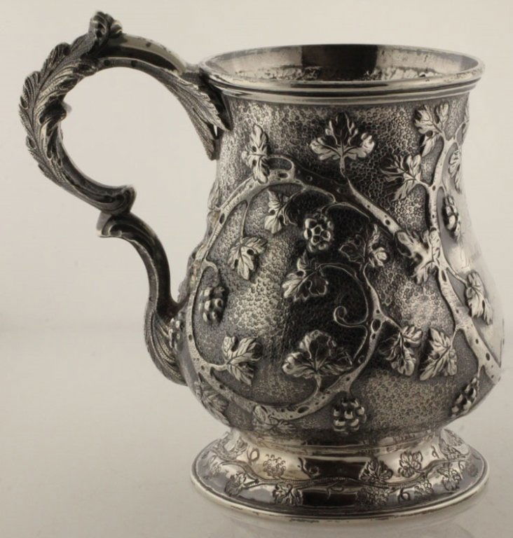 Vincent Laforme Coin Silver Repousse Mug: Vincent Laforme & Brother, Boston, Massachusetts, circa 1860. Marks: V.L. & B., BOSTON, PURE COIN, BIGELOW, BROS & KENNARD. 4 5/8" high. 6.23 troy ounces. The vasiform mug with repousse branch, foliat