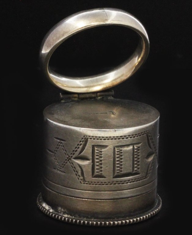 Swift & Fisher Silver Oil Container with Ring: Est $ 25 - 35 Swift & Fisher Silver Oil Container with Ring • made by Swift & Fisher of North Attleboro, MA circa 1915 • bears the marks: SF (bisected by arrow), STERLING • 1 1/8" in diameter an