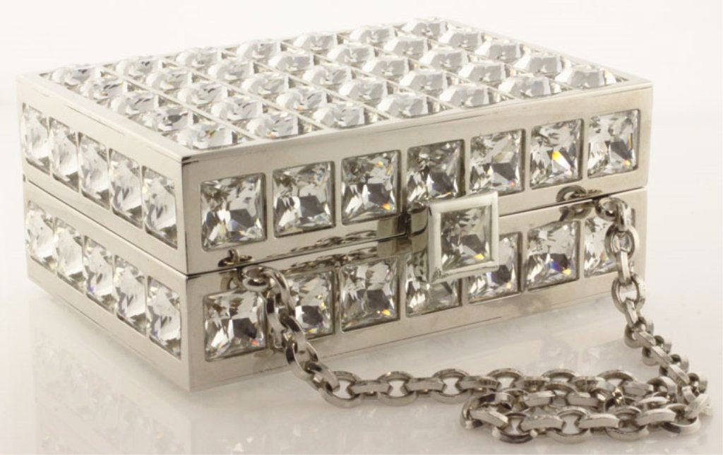 Judith Leiber Crystal Box Minaudiere Purse: Est. $700 - 1000 Judith Leiber Crystal Box Minaudiere Purse Judith Leiber crystal minaudiere box purse. Looks brand new. Purse is approx. 4 X 3 X 1 3/4 inches. Tucked away hand strap chain. Comes with